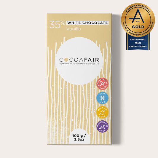 COCOAFAIR 100g 35% White Chocolate Packaging shot - Front view, Cream packaging on white background. Vanilla  flavoured chocolate. Aurora Challenge 2023 Gold Winner