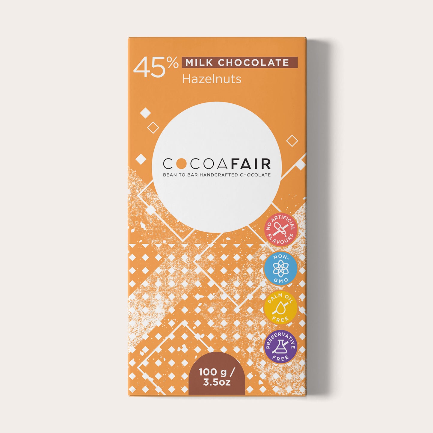 COCOAFAIR 100g 45% Milk Chocolate Packaging shot - Front view, Orange packaging on white background. Hazelnut flavoured chocolate