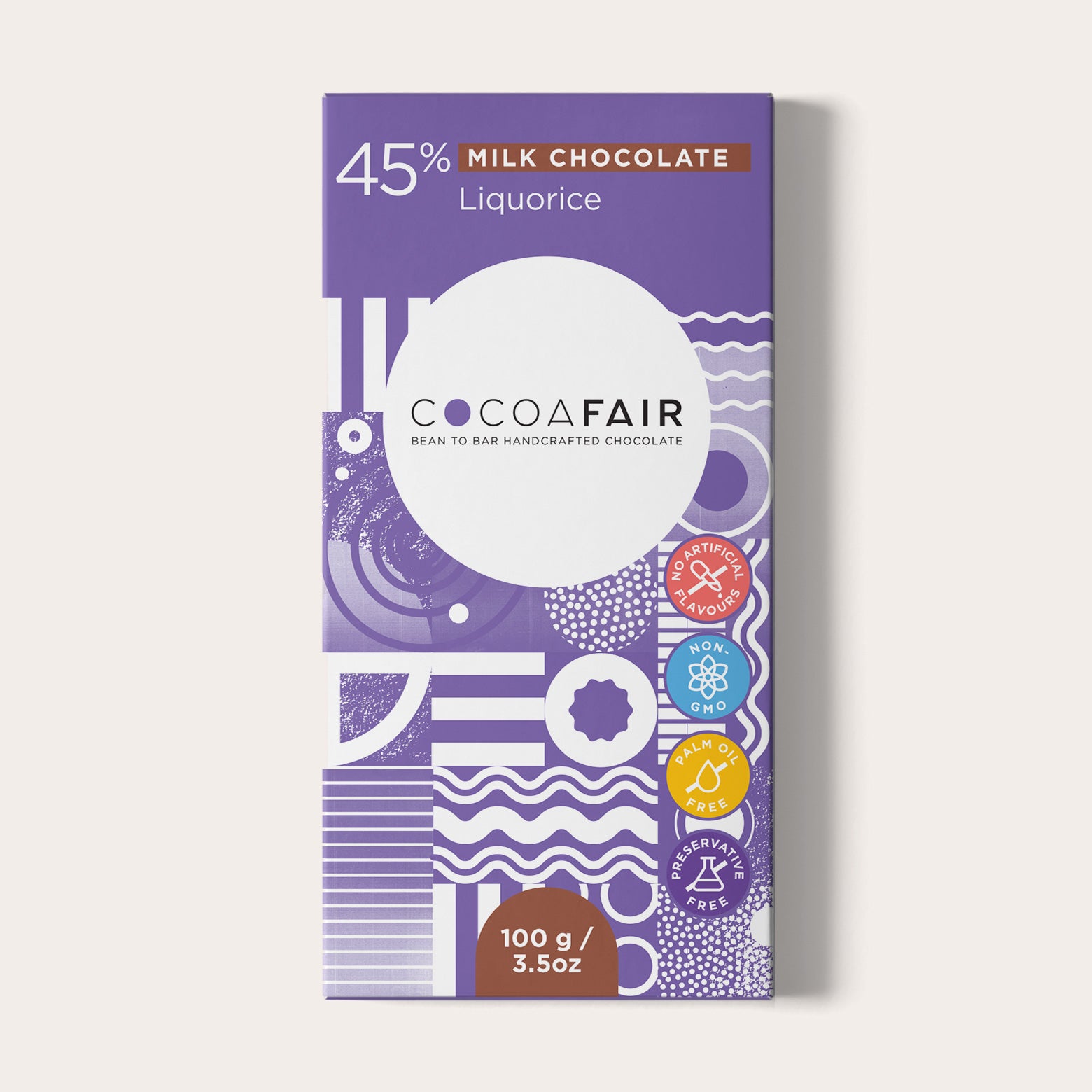 COCOAFAIR 100g 45% Milk Chocolate Packaging shot - Front view, Purple packaging on white background. Liquorice flavoured chocolate