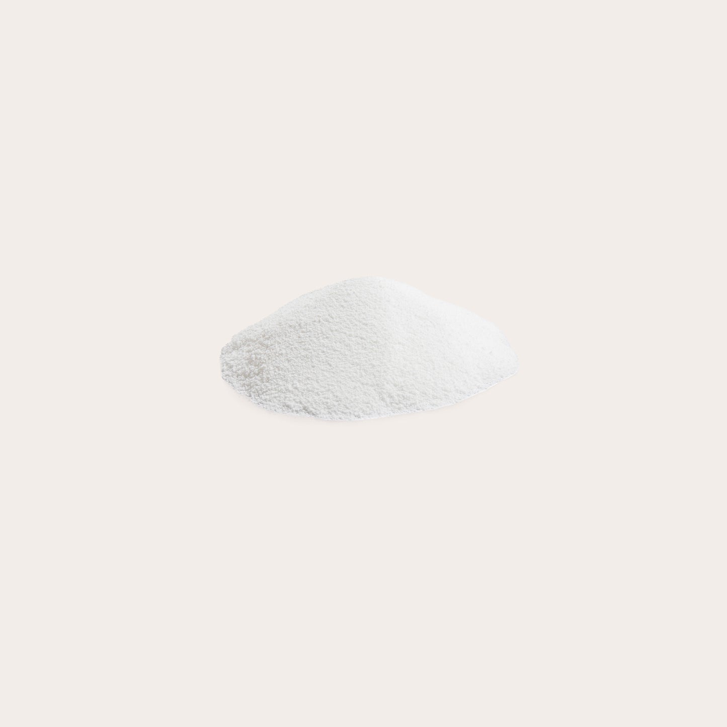 Coconut milk powder in a small heap against a white background