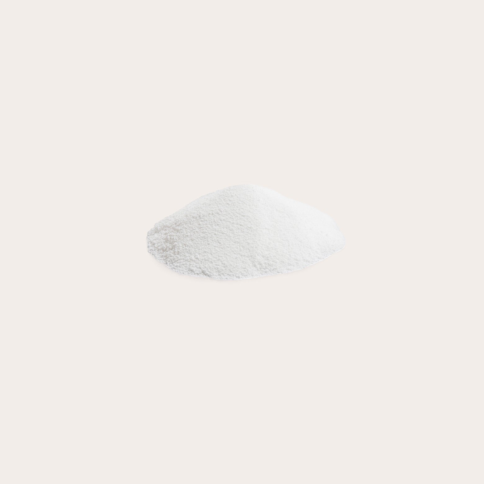 Coconut milk powder in a small heap against a white background