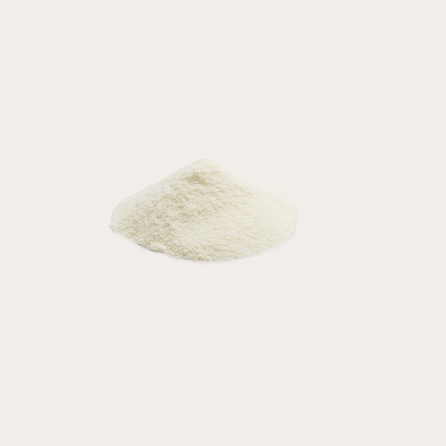 Full Cream Milk Powder in a small heap against a white background